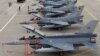 Azerbaijani - Turkish F-16 fighter jets parked at an Azerbaijani military airfield, 20Sep2014. 