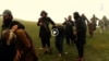 Grab from a video released in August 2015 that shows militants loyal to the Islamic State (IS) blowing up bound and blindfolded Afghan prisoners with explosives.