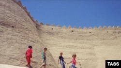 Children play near the ancient walls of the Uzbek city of Khiva.